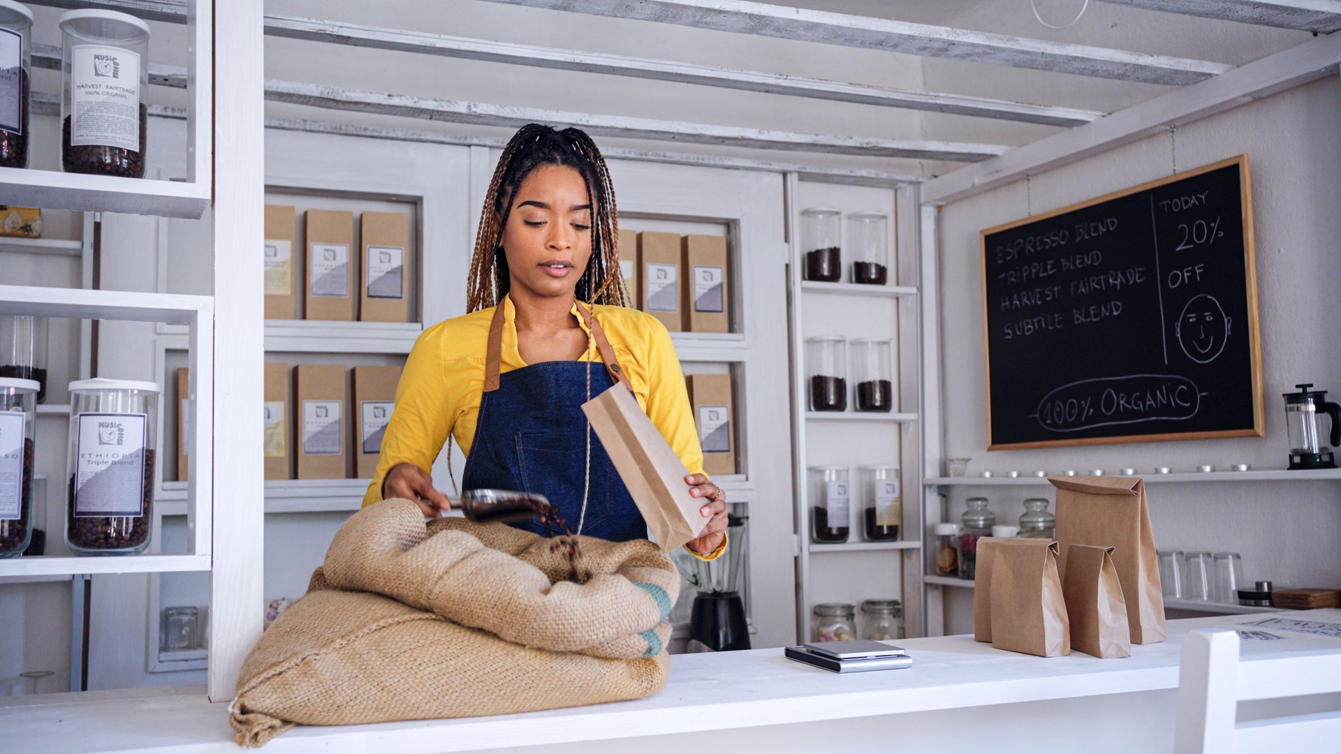 Latina woman running eco-friendly coffee shop. Small business owner.